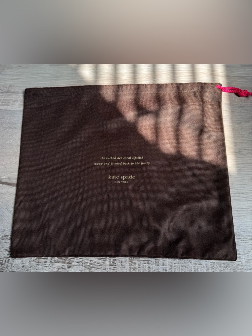 Kate Spade New York. Signature dust bag—a protective pouch designed for storing